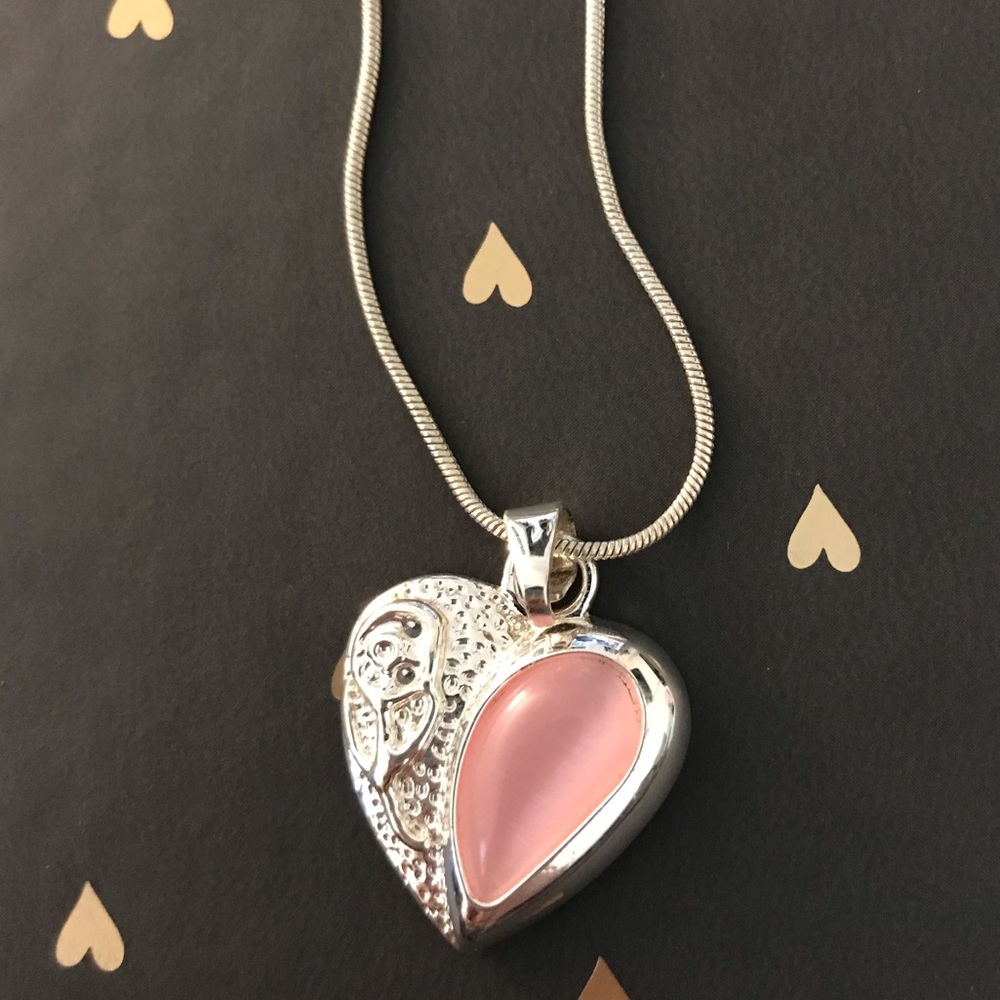 Never Worn! Heart Charmed necklace.